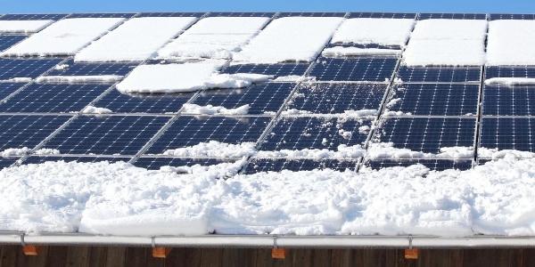 solar panels with snow sliding off